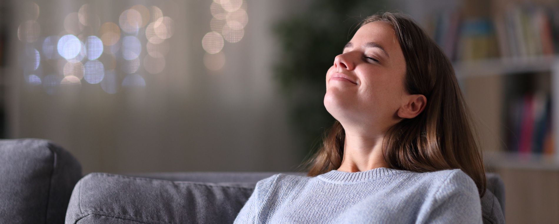 Woman breathing fresh air indoors